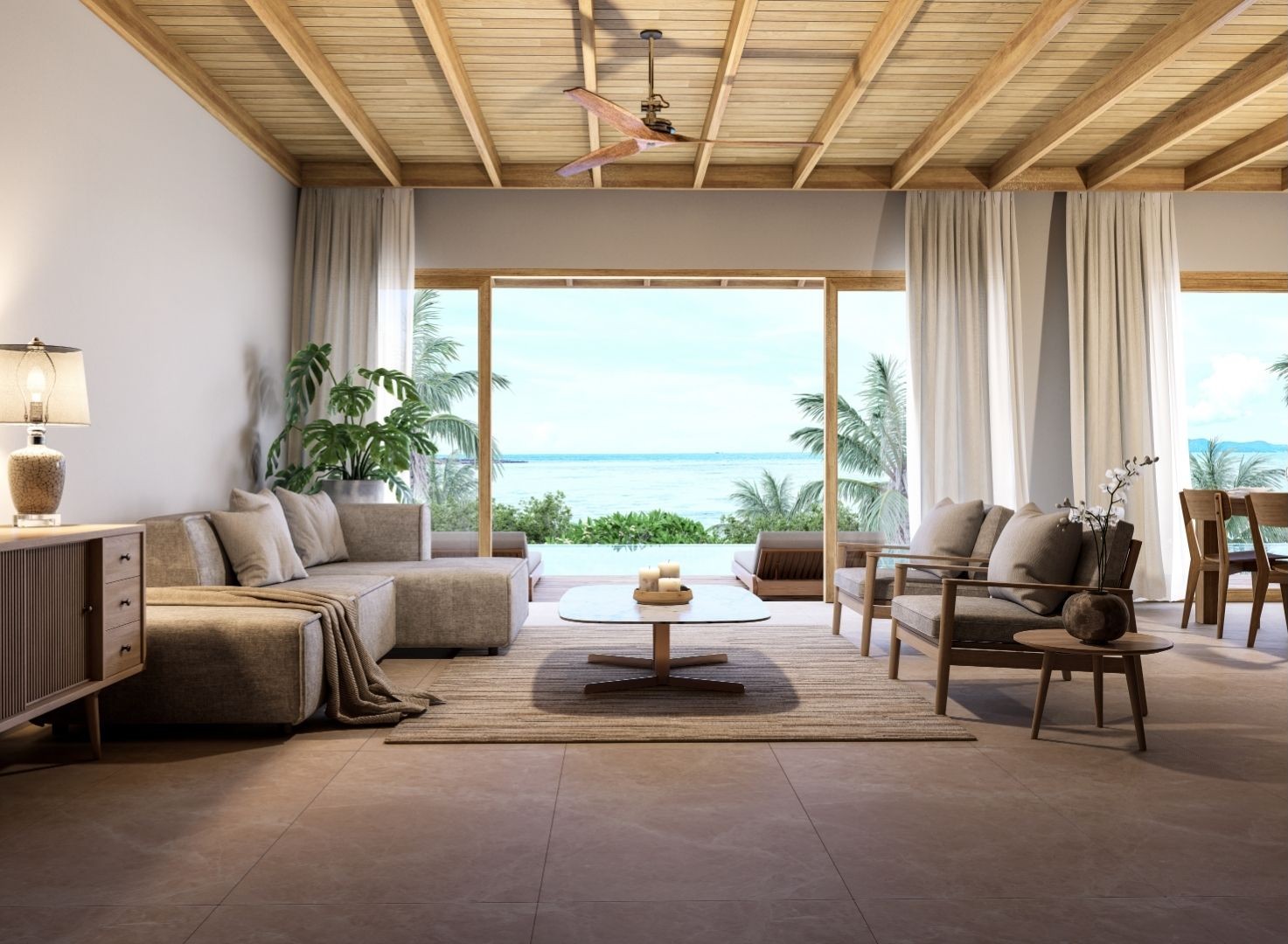 Coastal Elegance lounge in taupe and sand tones opening to a terrace with a sea view